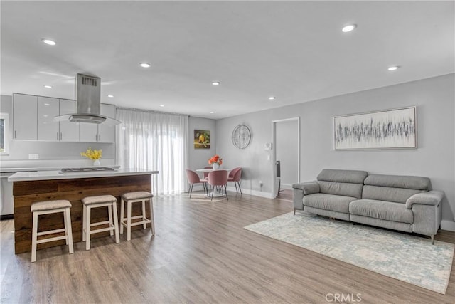 7293 Cirrus Way, West Hills, CA 91307 - living area featuring light wood finished floors, recessed lighting, and baseboards
