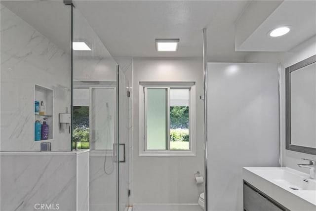 7293 Cirrus Way, West Hills, CA 91307 - bathroom with toilet, a marble finish shower, and vanity