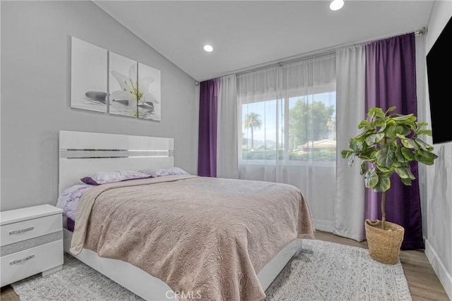 7293 Cirrus Way, West Hills, CA 91307 - bedroom with vaulted ceiling, recessed lighting, and light wood finished floors