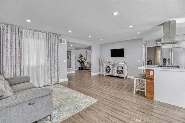 7293 Cirrus Way, West Hills, CA 91307 - living room with recessed lighting, light wood finished floors, and baseboards