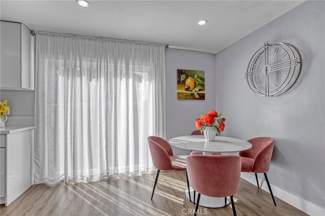7293 Cirrus Way, West Hills, CA 91307 - dining room with wood finished floors, recessed lighting, and baseboards