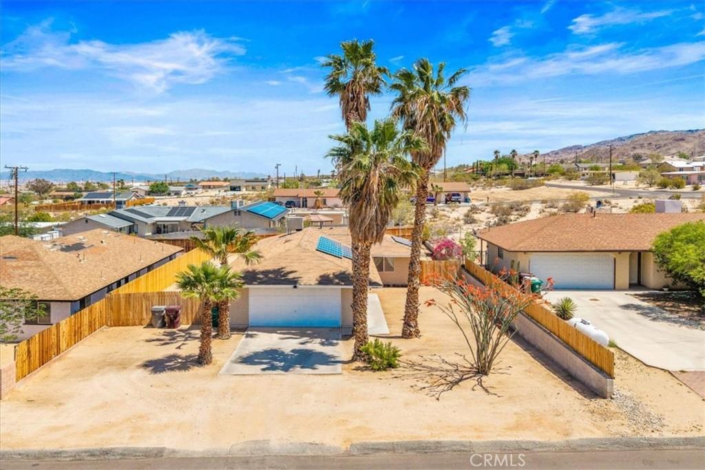 6669 Pine Spring Ave Unit 29, Palms, CA 92277 - drone / aerial view featuring a residential view and a mountain view