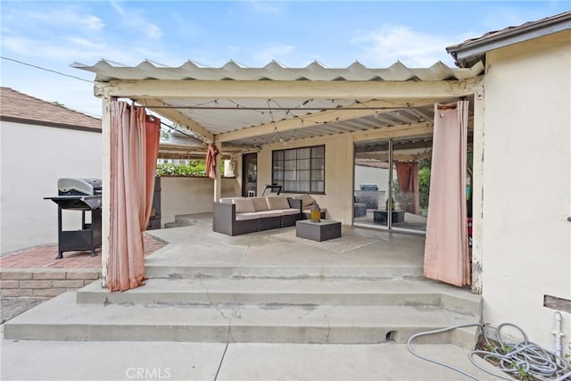 view of patio with grilling area and outdoor lounge area