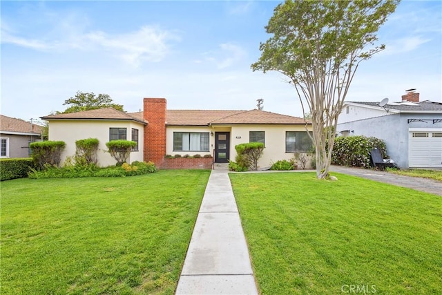 ranch-style house with stucco siding, a chimney, and a front lawn