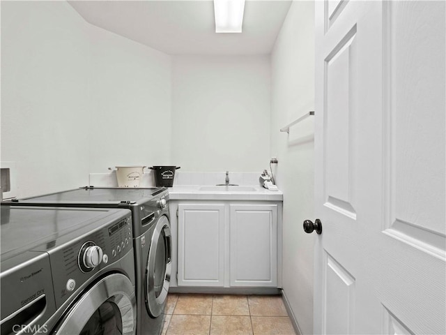 25626 Moore Ln, Stevenson Ranch, CA 91381 - clothes washing area with washing machine and dryer, cabinet space, and light tile patterned floors