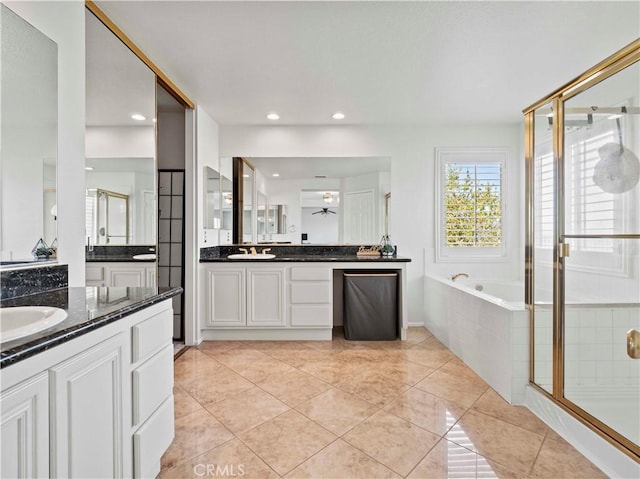 25626 Moore Ln, Stevenson Ranch, CA 91381 - full bathroom with a shower stall, a bath, tile patterned flooring, two vanities, and recessed lighting