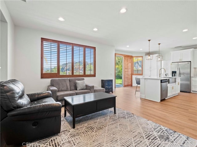 25626 Moore Ln, Stevenson Ranch, CA 91381 - living room featuring recessed lighting and light wood-style floors