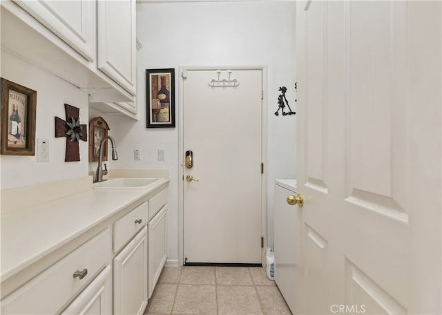 doorway to outside with a sink and light tile patterned floors