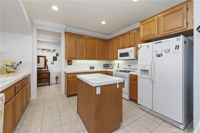 kitchen featuring tile countertops, white appliances, a toaster, ornamental molding, and a kitchen island