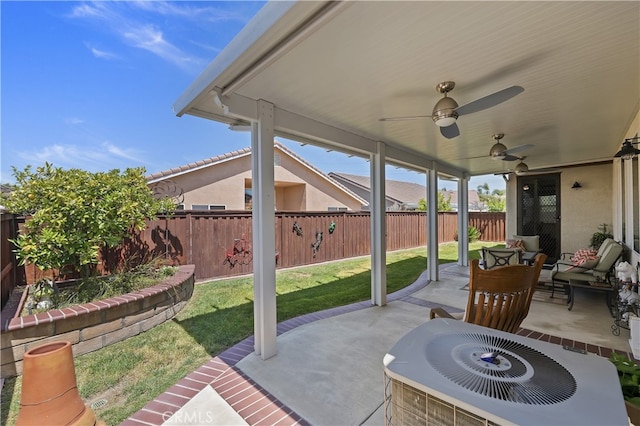 view of patio / terrace with a fenced backyard, central AC unit, ceiling fan, and an outdoor hangout area