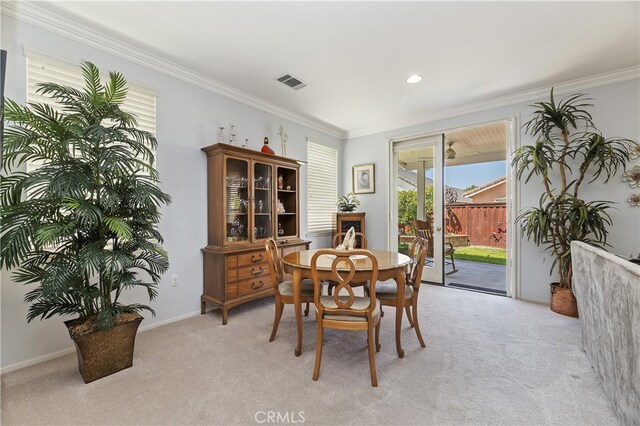 dining area featuring light colored carpet, ornamental molding, visible vents, and recessed lighting