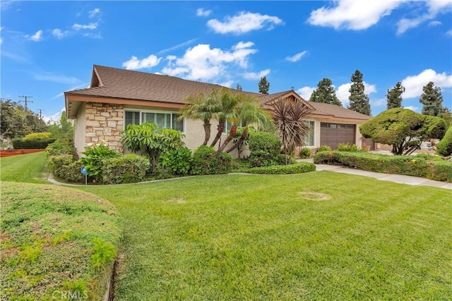 view of front facade with stone siding, a front yard, and a garage