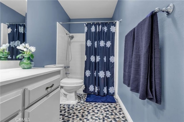 full bath featuring baseboards, toilet, and vanity