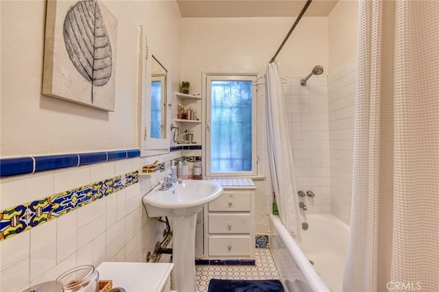 4912 Edgewood Pl, Los Angeles, CA 90019 - full bathroom featuring tile walls, tile patterned flooring, a wainscoted wall, and shower / bath combo