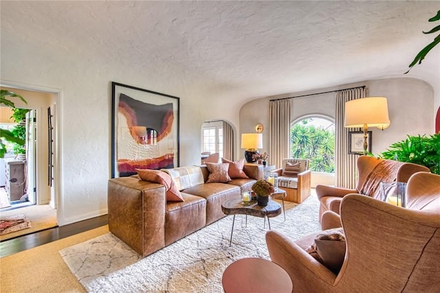 4912 Edgewood Pl, Los Angeles, CA 90019 - living room with baseboards, a textured ceiling, a textured wall, and wood finished floors