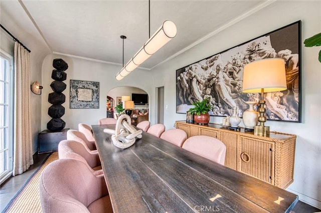 4912 Edgewood Pl, Los Angeles, CA 90019 - dining room with arched walkways, ornamental molding, and wood finished floors