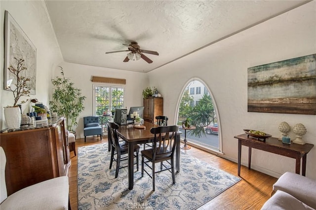 4912 Edgewood Pl, Los Angeles, CA 90019 - dining room with a ceiling fan, light wood finished floors, and a textured ceiling