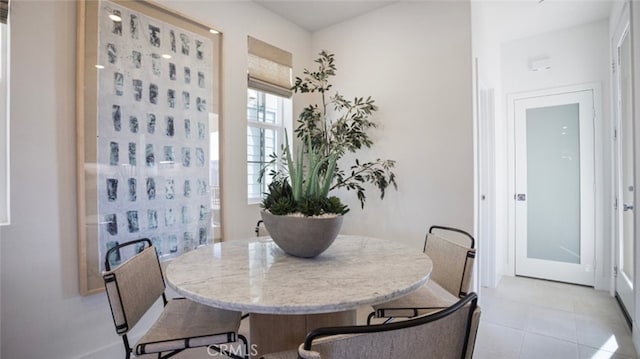 dining area featuring light tile patterned floors