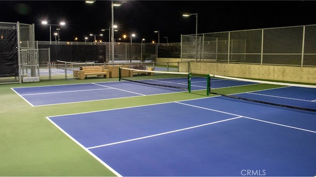 view of sport court with community basketball court and fence