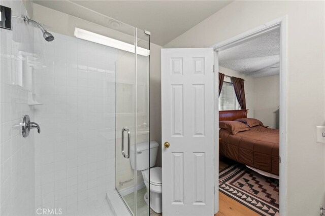 ensuite bathroom featuring ensuite bath, toilet, and a stall shower