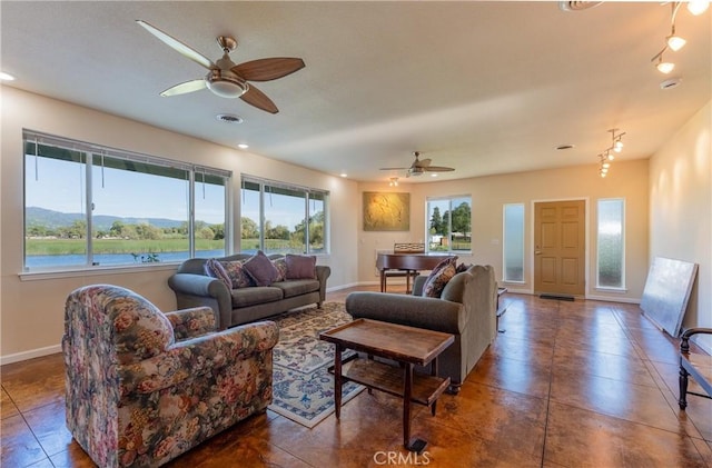 living area with baseboards, a ceiling fan, visible vents, and recessed lighting