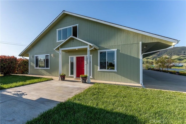 2260 Lakeshore Blvd, Upper Lake, CA 95485 - view of front of house with a front lawn and a carport