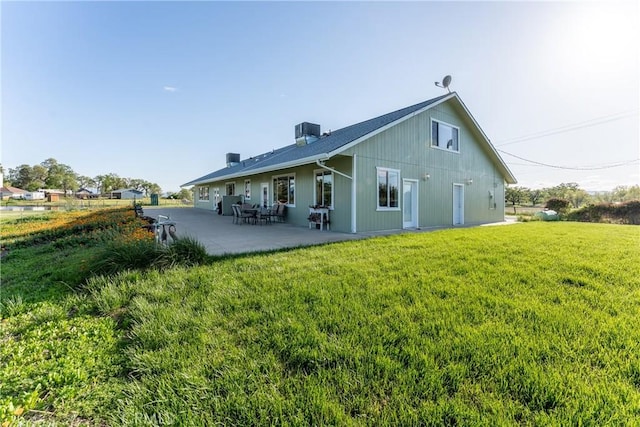 2260 Lakeshore Blvd, Upper Lake, CA 95485 - rear view of house featuring a yard, a patio area, and a chimney