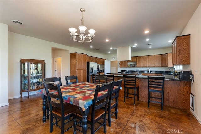 dining area with baseboards, a chandelier, visible vents, and recessed lighting