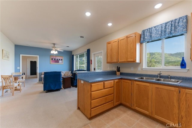 2260 Lakeshore Blvd, Upper Lake, CA 95485 - kitchen with healthy amount of natural light, a ceiling fan, dark countertops, a peninsula, and recessed lighting