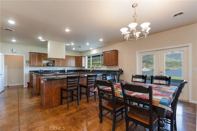 dining area featuring an inviting chandelier, french doors, visible vents, and recessed lighting