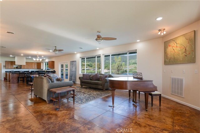 living room with recessed lighting, visible vents, baseboards, and ceiling fan