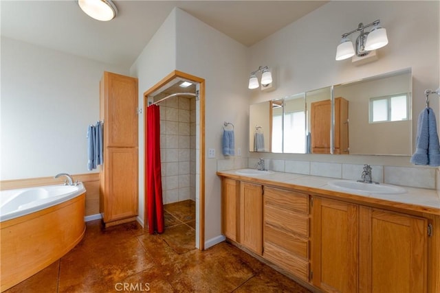 full bath with a bath, double vanity, tile patterned flooring, and a sink