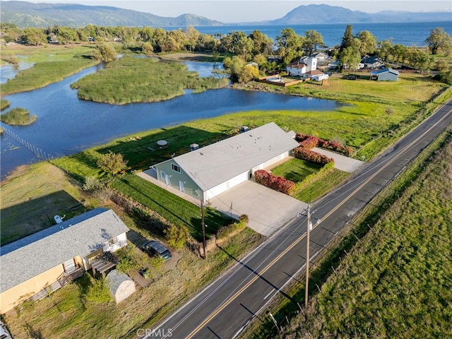 bird's eye view with a water and mountain view