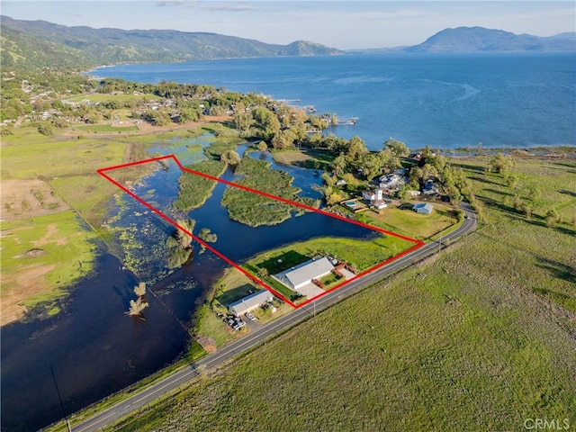 bird's eye view featuring a water and mountain view