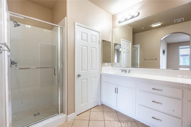 25102 Goodrich Ct, Stevenson Ranch, CA 91381 - bathroom with visible vents, vanity, tile patterned flooring, and a stall shower