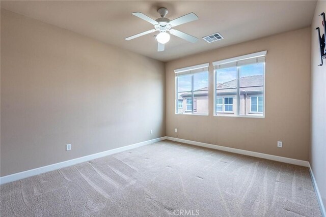 25102 Goodrich Ct, Stevenson Ranch, CA 91381 - unfurnished room featuring ceiling fan, light carpet, visible vents, and baseboards