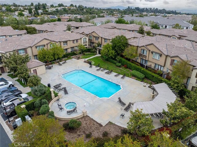 25102 Goodrich Ct, Stevenson Ranch, CA 91381 - community pool featuring a residential view and a patio
