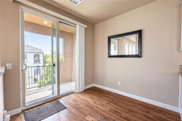 25102 Goodrich Ct, Stevenson Ranch, CA 91381 - entryway featuring wood finished floors, visible vents, and baseboards