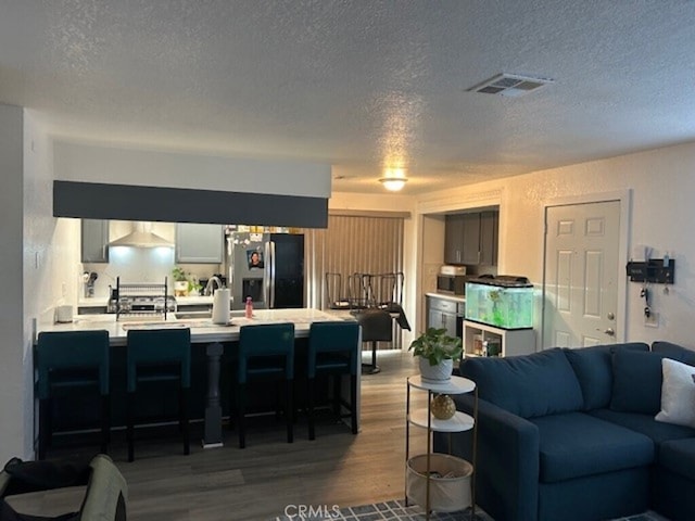 1508 Sunrise Rd, Barstow, CA 92311 - living room with wood finished floors and a textured ceiling