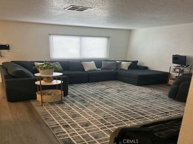 1508 Sunrise Rd, Barstow, CA 92311 - living room featuring wood finished floors and a textured ceiling