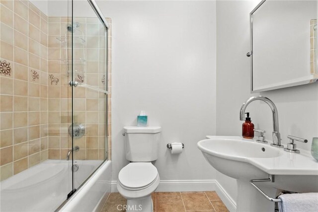 25174 Mulholland Hwy, Calabasas, CA 91302 - bathroom with baseboards, toilet, combined bath / shower with glass door, and tile patterned floors