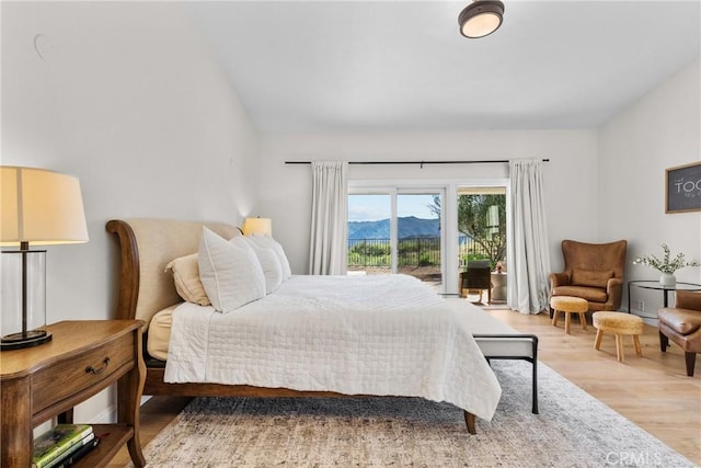 25174 Mulholland Hwy, Calabasas, CA 91302 - bedroom with light wood-style flooring, access to outside, a mountain view, and lofted ceiling