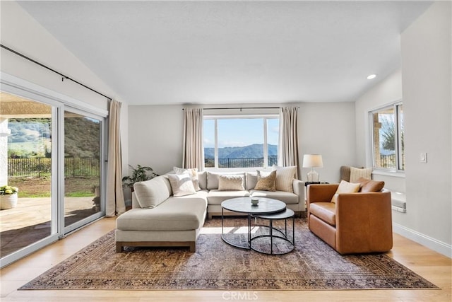 25174 Mulholland Hwy, Calabasas, CA 91302 - living room featuring plenty of natural light, wood finished floors, a mountain view, and recessed lighting