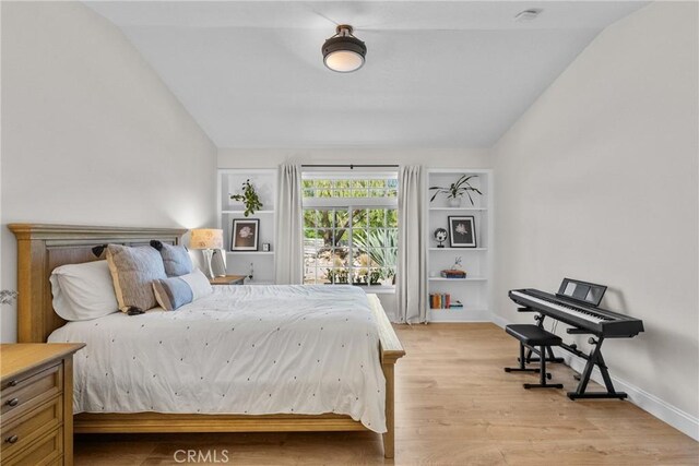 25174 Mulholland Hwy, Calabasas, CA 91302 - bedroom featuring vaulted ceiling, light wood-style flooring, and baseboards