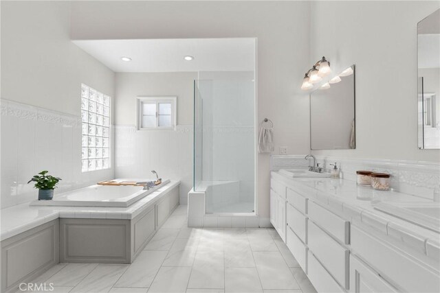25174 Mulholland Hwy, Calabasas, CA 91302 - full bath with a bath, a stall shower, double vanity, a wainscoted wall, and marble look tiles
