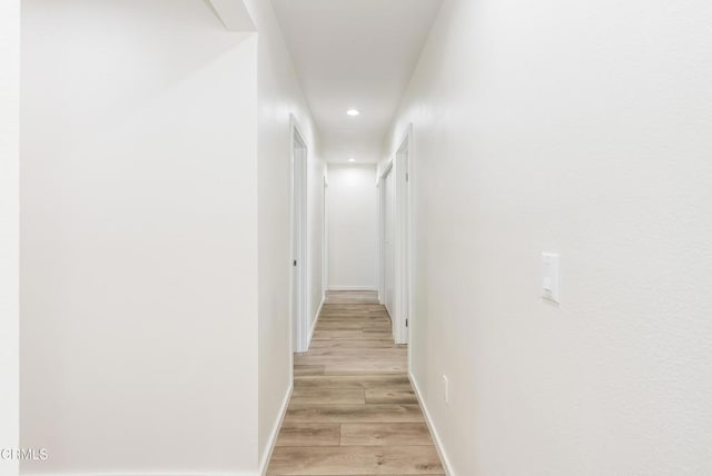 8751 Odessa Ave, North Hills, CA 91343 - corridor with recessed lighting and light wood-type flooring
