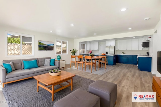 8751 Odessa Ave, North Hills, CA 91343 - living area with plenty of natural light, light wood-type flooring, and recessed lighting
