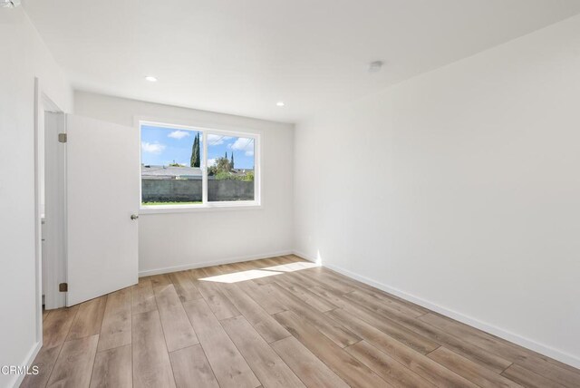 8751 Odessa Ave, North Hills, CA 91343 - empty room with light wood-type flooring and recessed lighting