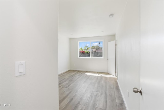 8751 Odessa Ave, North Hills, CA 91343 - unfurnished room featuring light wood-type flooring and a smoke detector