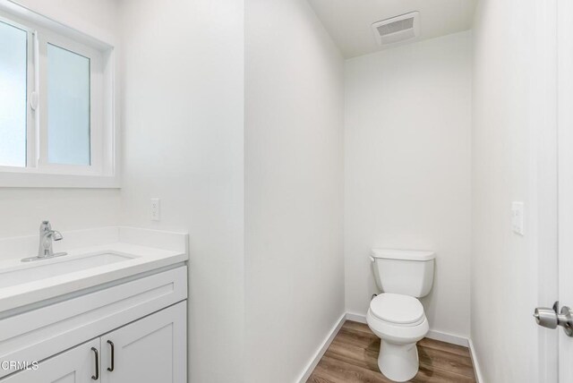 8751 Odessa Ave, North Hills, CA 91343 - half bath with wood finished floors and vanity